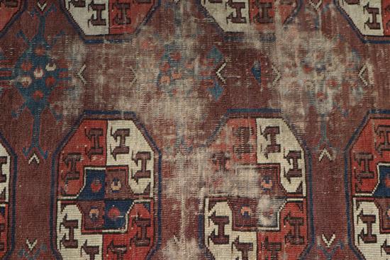 A Bokhara burgundy ground carpet 287 x 172cm